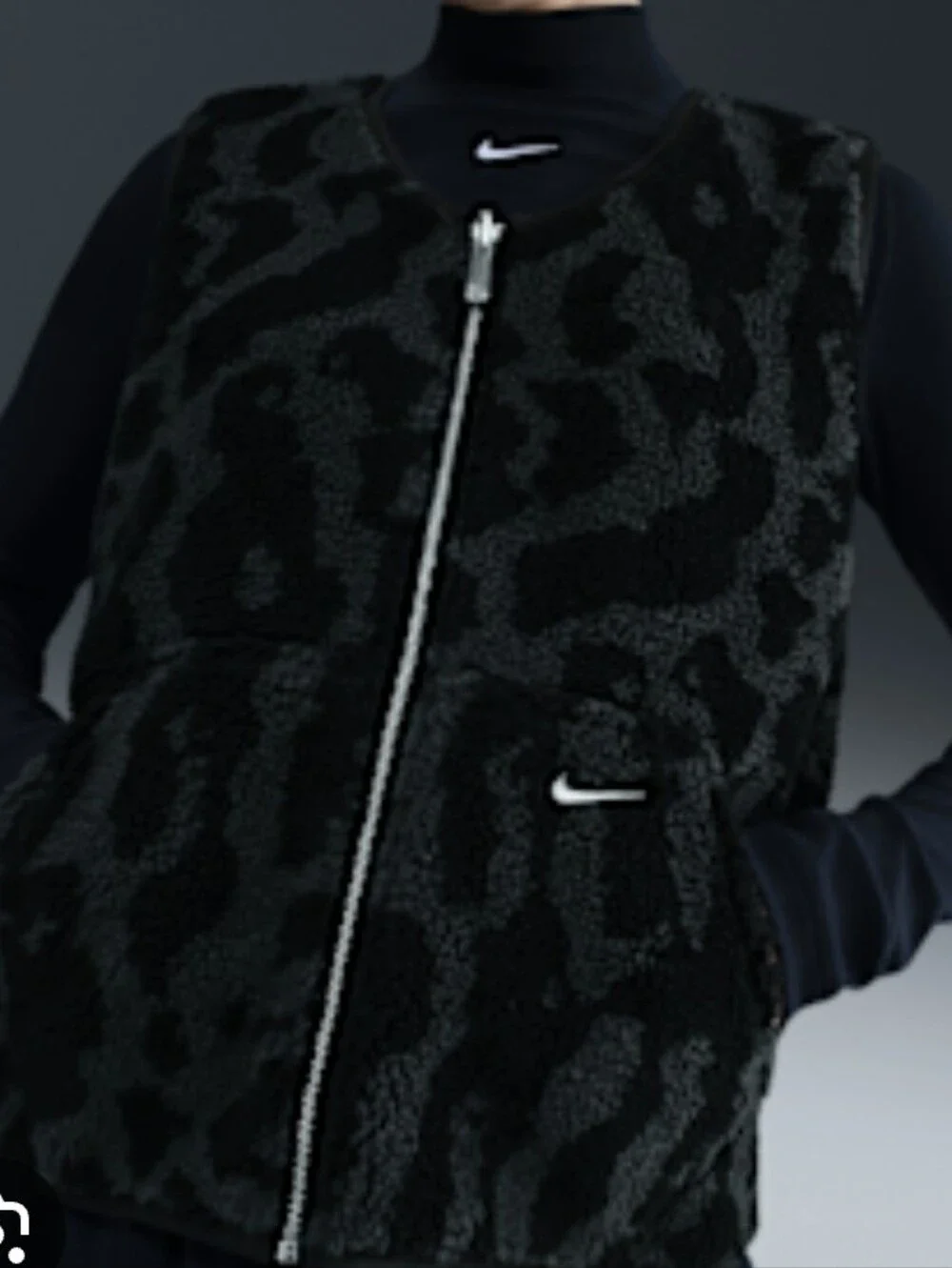 Nike Street reversible sherpa vest in black and leopard print